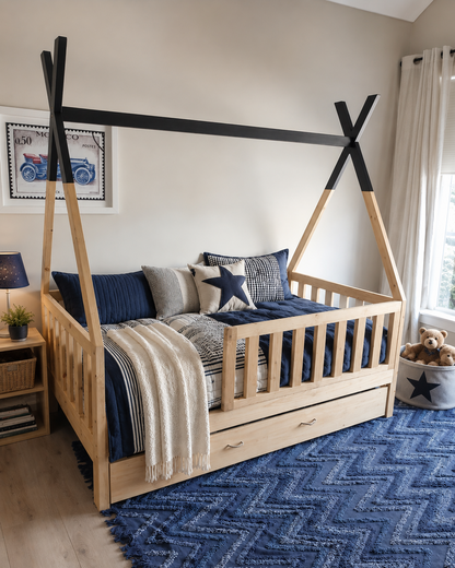 Children's bedroom with a wooden bed, blue rug, and decorative pillows.