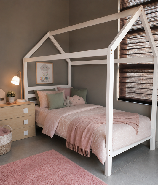 Children's bedroom with a house-shaped bed, pink bedding, and neutral walls.