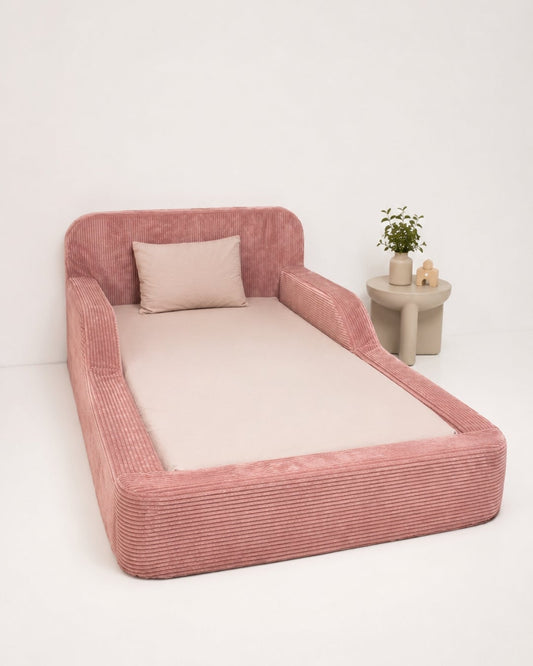Pink pet bed with a white cushion on a white background. Toddler Foam bed