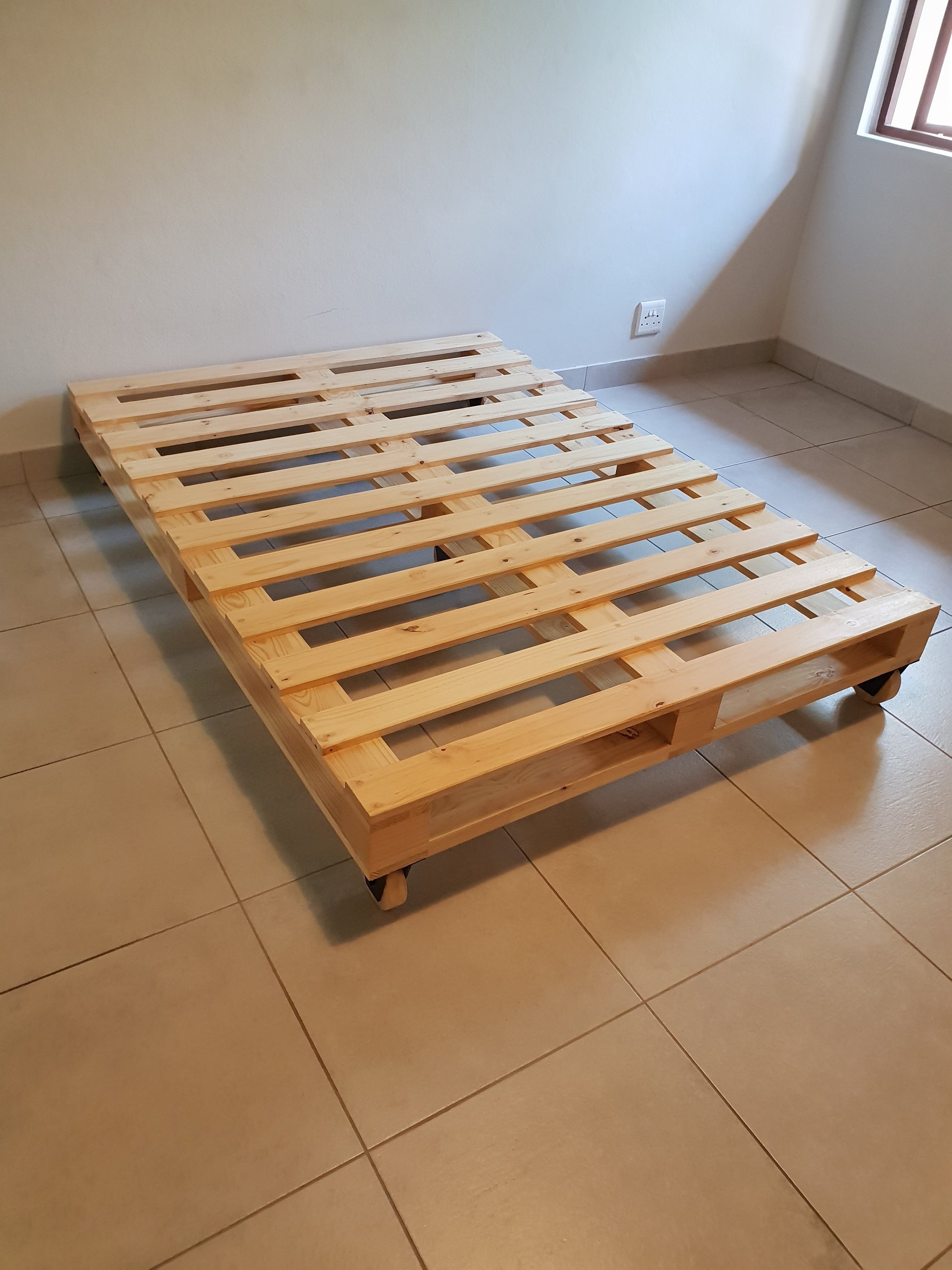 Crafted Pallet Wheel Bed - Furniture